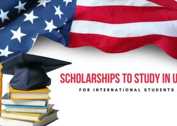Scholarships to study in the USA for international students with books, graduation cap, and American flag