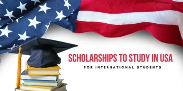 Scholarships to study in the USA for international students with books, graduation cap, and American flag