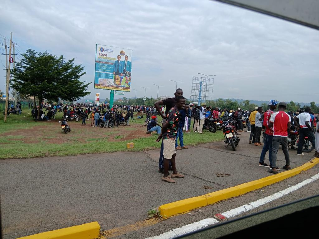 Large crowd gathered near Kisumu International Airport on February 21, 2026, waiting