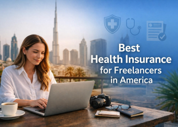 Freelancer woman working on a laptop with Dubai skyline background illustrating best health insurance options for freelancers in America