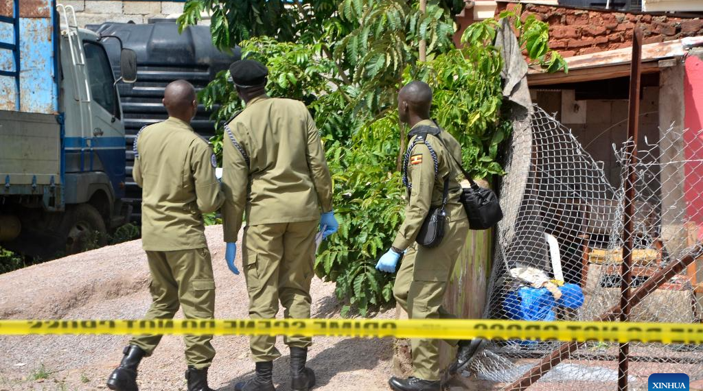 Security personnel at Ggaba nursery school crime scene, Kampala, after the 2026 massacre"