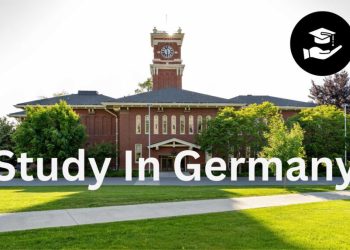 alt="Beautiful historic university campus in Germany with clock tower and green lawns, ideal for international students in 2026"