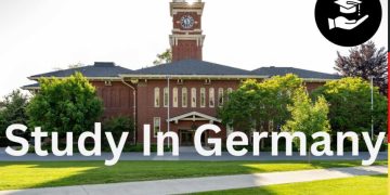 alt="Beautiful historic university campus in Germany with clock tower and green lawns, ideal for international students in 2026"
