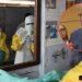 alt="Petition filed to block proposed Ebola quarantine facility in Kenya - Medical workers in PPE and Health CS Aden Duale"