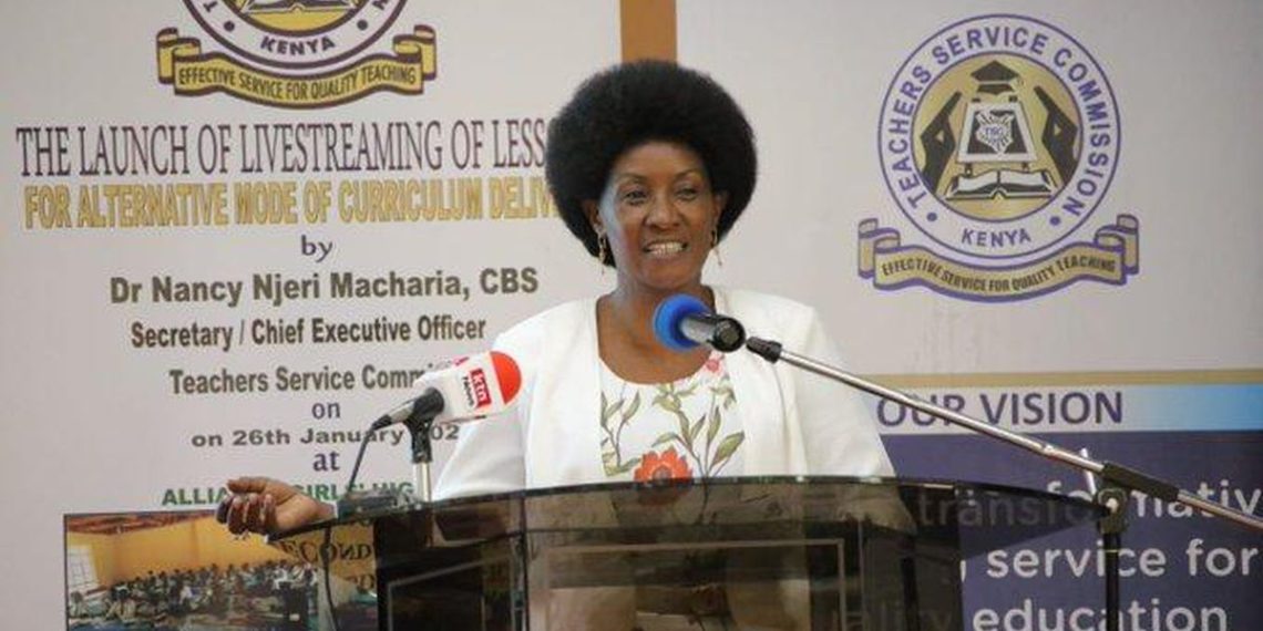 "Dr. Nancy Njeri Macharia, TSC Kenya CEO, speaking at a podium during the launch of livestreaming lessons for alternative curriculum delivery."