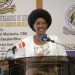 "Dr. Nancy Njeri Macharia, TSC Kenya CEO, speaking at a podium during the launch of livestreaming lessons for alternative curriculum delivery."