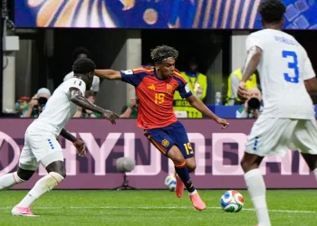 Spain's young midfielder dribbles past two Cape Verde defenders during a FIFA World Cup 2026 group-stage match, showcasing close ball control in a tense contest that ended in a surprising 0-0 draw.