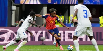 Spain's young midfielder dribbles past two Cape Verde defenders during a FIFA World Cup 2026 group-stage match, showcasing close ball control in a tense contest that ended in a surprising 0-0 draw.