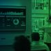 Businesswoman presenting futuristic financial dashboard with AI and data analytics in a modern office, representing the future of global capital markets