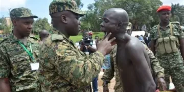 UPDF officers carrying out physical screening during the massive 2026 recruitment drive for 10,200 soldiers