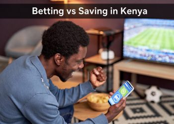 Young Kenyan man excited while betting on phone vs saving concept