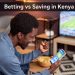 Young Kenyan man excited while betting on phone vs saving concept