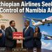 Ethiopian Airlines and Namibian officials exchange #VisitNamibia plaque with Ethiopian A350 and Air Namibia aircraft flying in the background – Ethiopian Airlines Seeks Control of Namibia Air