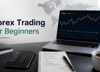 Desk setup for forex trading for beginners with laptop chart, phone quotes, and beginner notes.