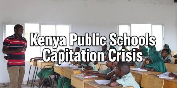 Kenyan teacher instructing primary school pupils in green uniforms inside a bright classroom with bold overlay text “Kenya Public Schools Capitation Crisis”