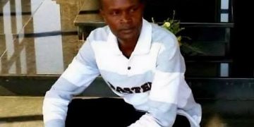 Standard Group Associate Editor Alex Kiprotich sitting on stairs with text overlay “Standard Editor Alex Kiprotich Abducted”
