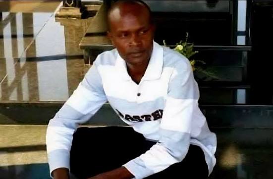 Standard Group Associate Editor Alex Kiprotich sitting on stairs with text overlay “Standard Editor Alex Kiprotich Abducted”